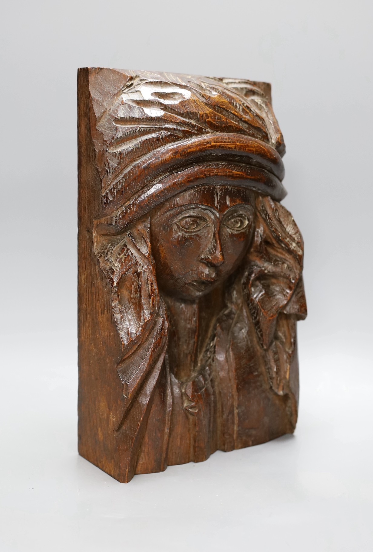 A carved oak figural appliqué, 28.5 cms high